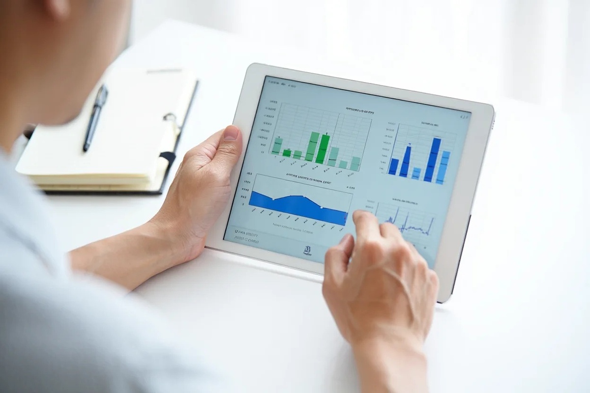 Options contract exploration on tablet and notebook in bright finance setting